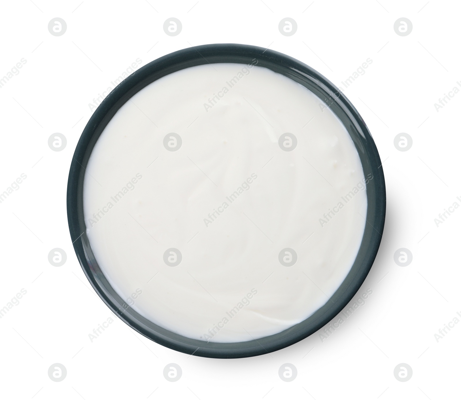 Photo of Bowl with delicious organic yogurt isolated on white, top view