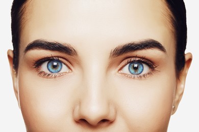 Image of Beautiful woman with captivating light blue eyes, closeup