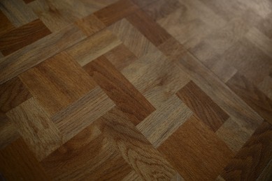 Wooden parquet floor as background, closeup view