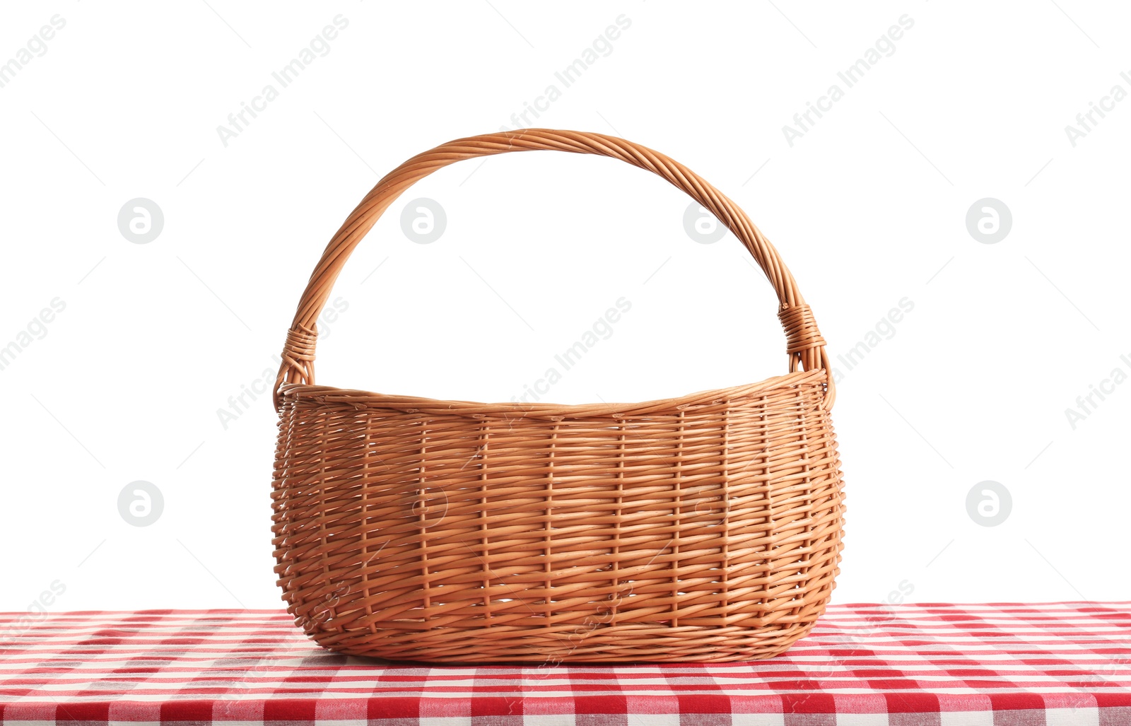 Photo of Empty picnic basket on checkered tablecloth against white background