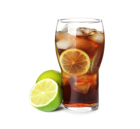 Glass of drink with ice cubes and limes isolated on white
