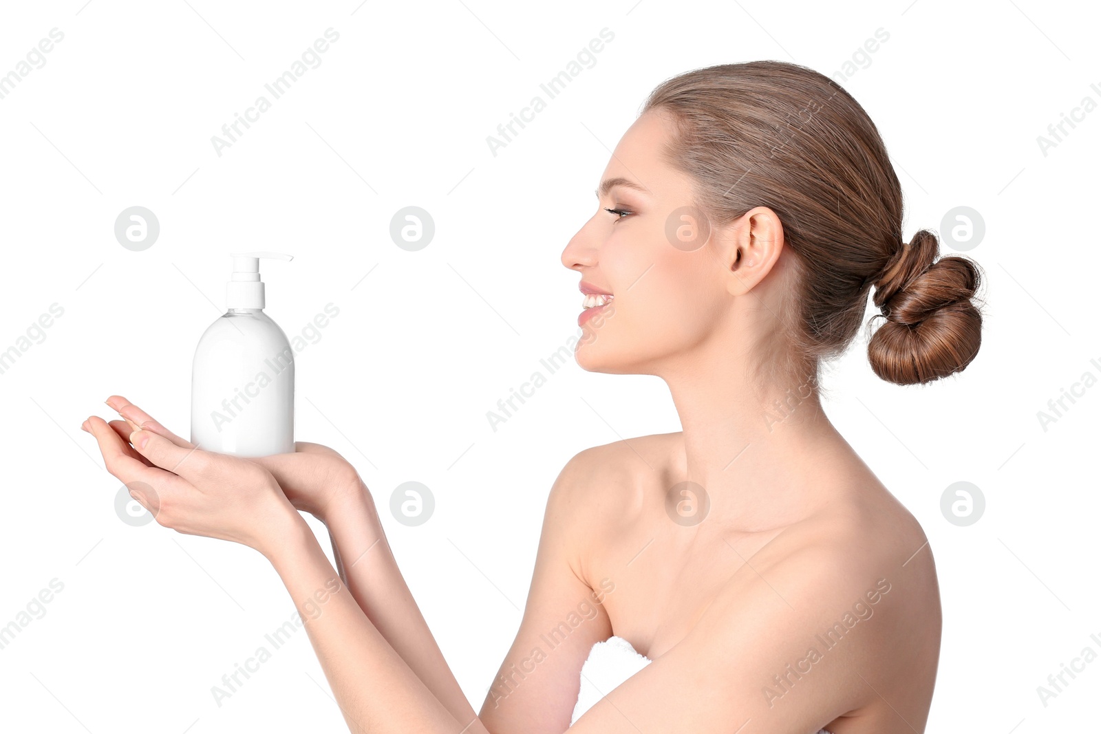 Photo of Young woman with bottle of hand cream on white background