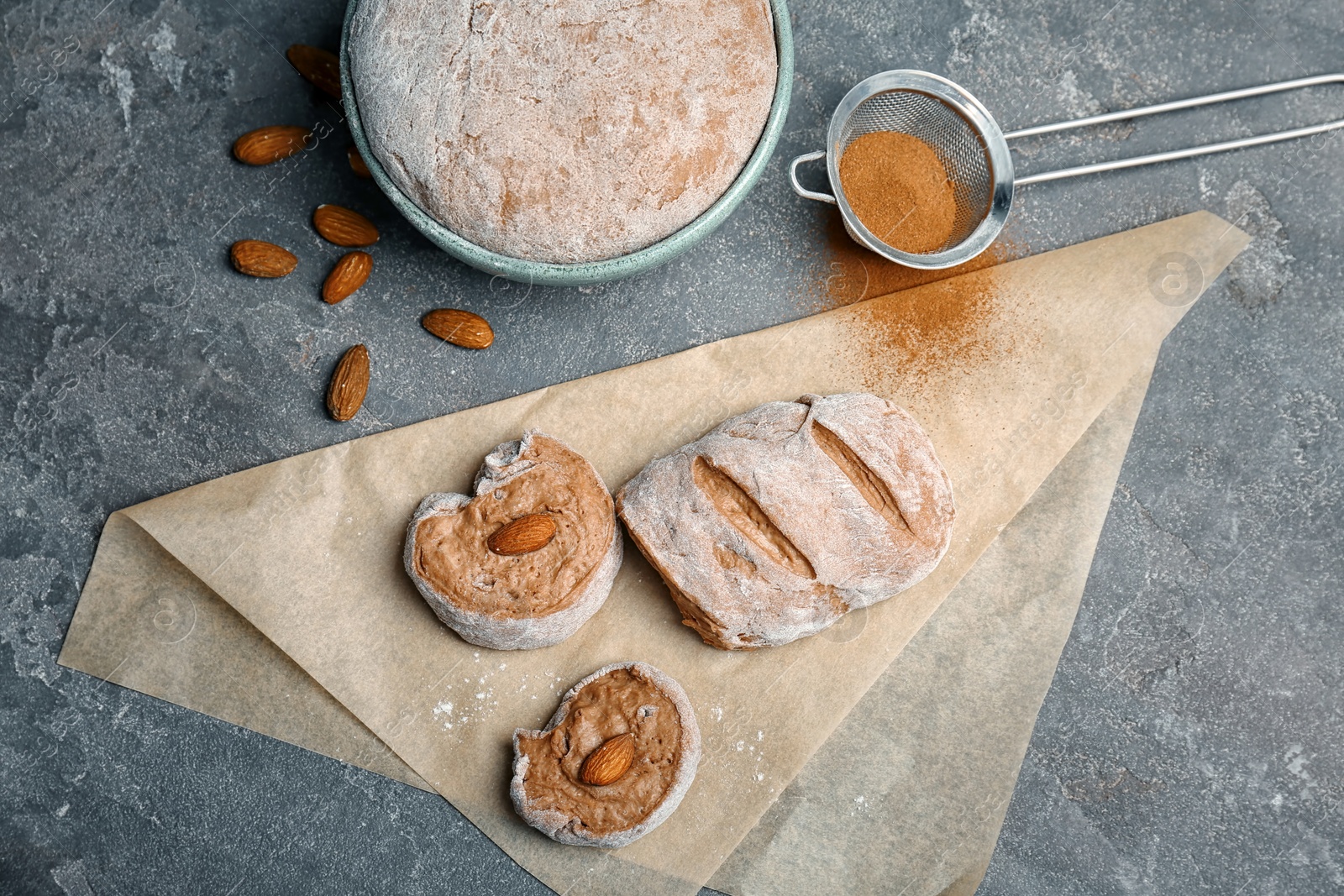 Photo of Flat lay composition with raw rye dough and almonds on grey background