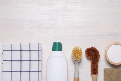 Photo of Flat lay composition with different cleaning supplies on light wooden background, space for text