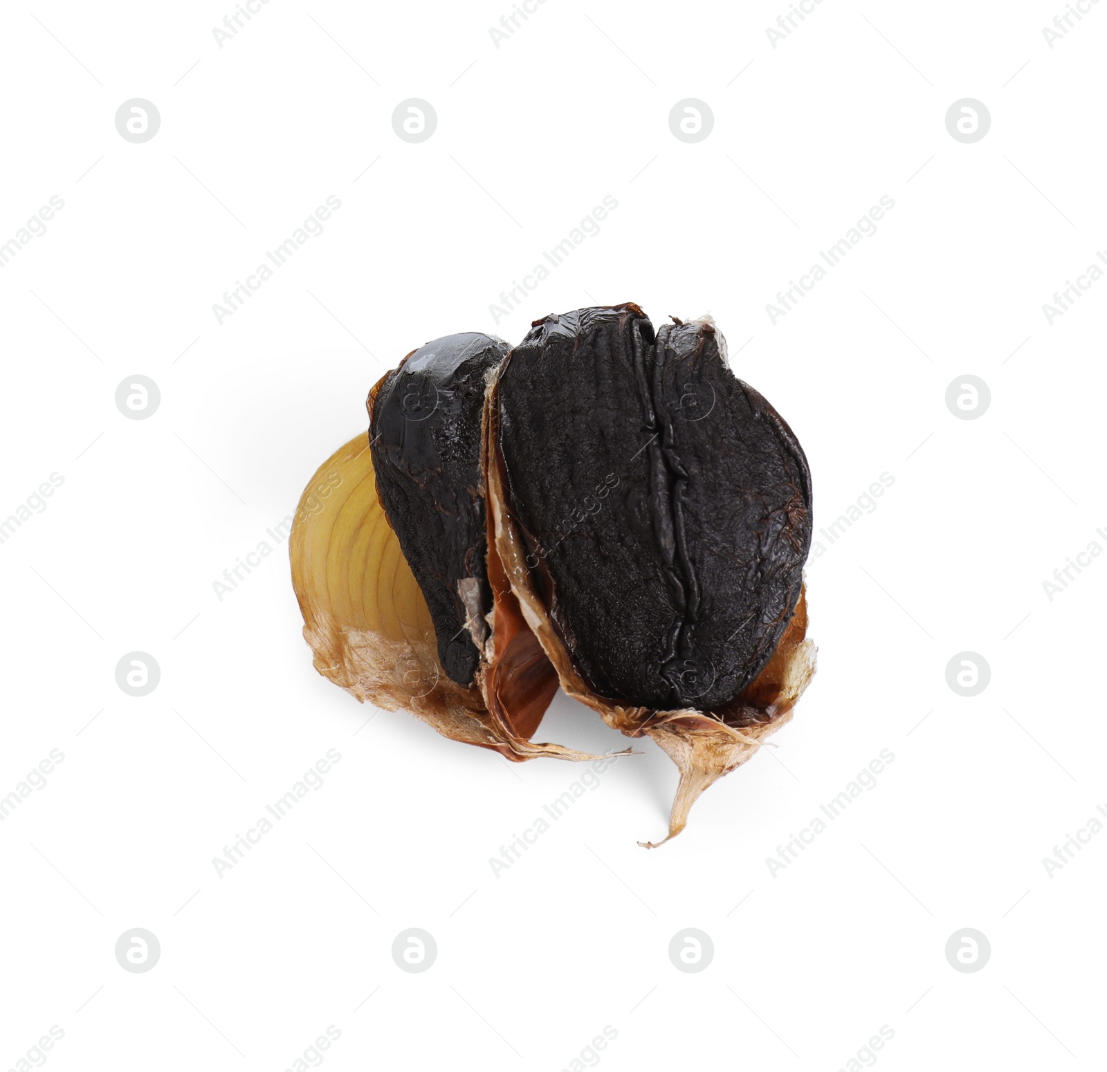 Photo of Cloves of fermented black garlic isolated on white