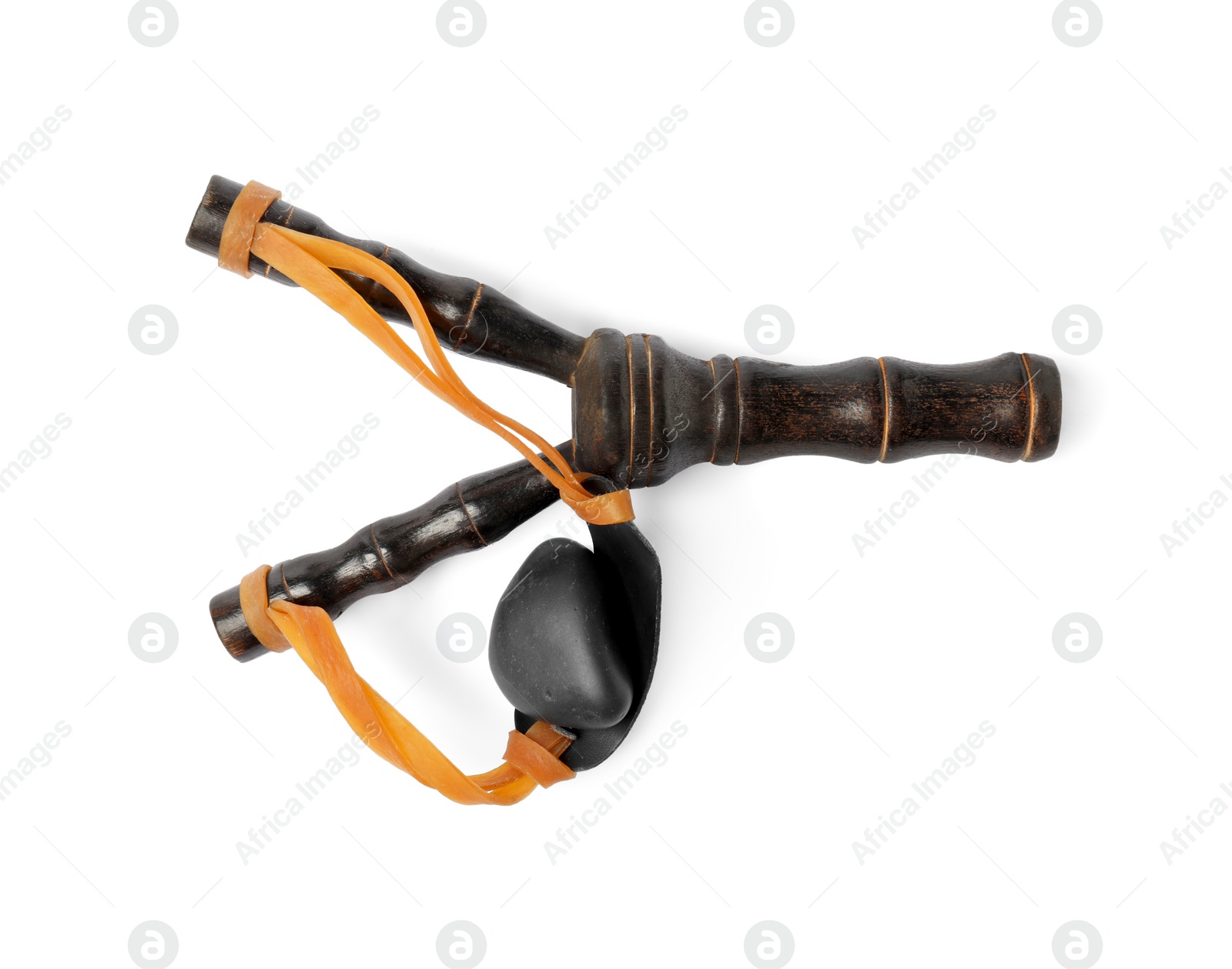 Photo of Black wooden slingshot with stone on white background, top view