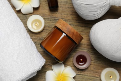Photo of Flat lay composition with different spa products on wooden table