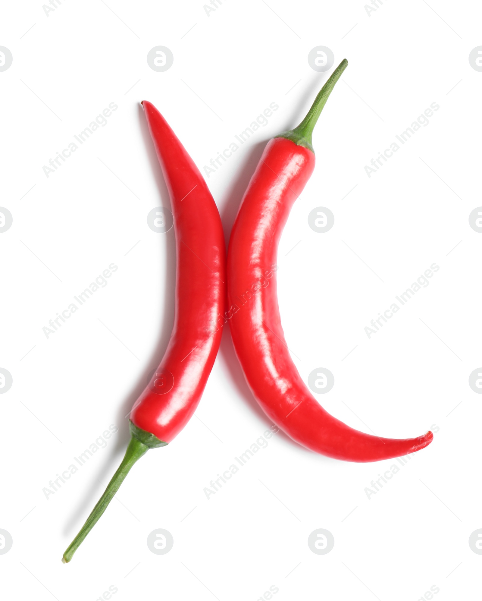 Photo of Red hot chili peppers on white background, top view