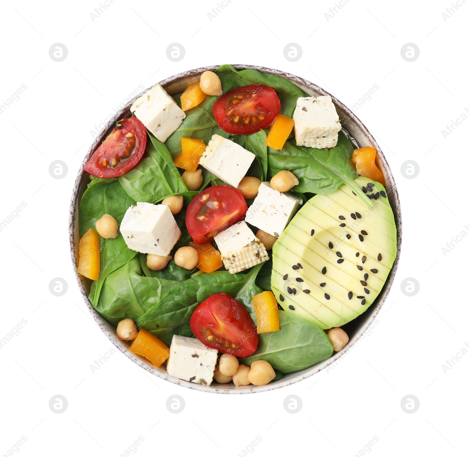 Photo of Bowl of tasty salad with tofu and vegetables isolated on white, top view