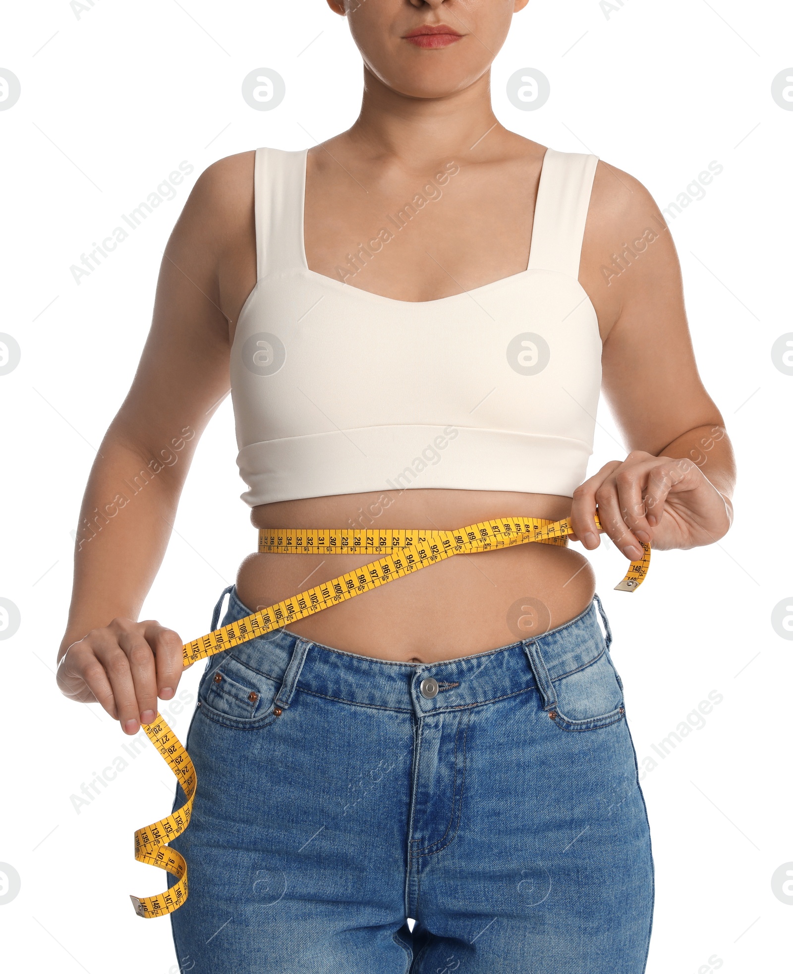 Photo of Woman measuring waist with tape on white background, closeup