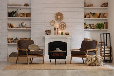 Photo of Cozy living room interior with comfortable armchairs near fireplace
