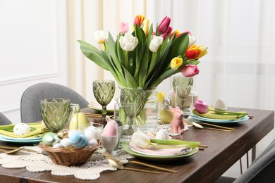 Photo of Festive table setting with beautiful flowers. Easter celebration