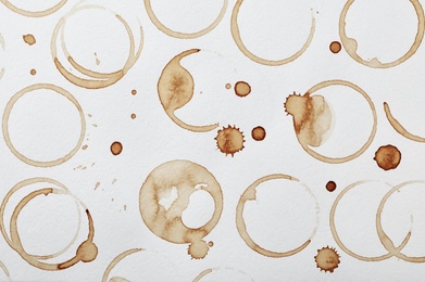 Photo of Dried coffee cup stains on white background, top view