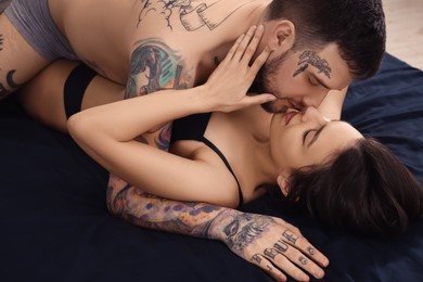 Photo of Passionate young couple having sex on bed
