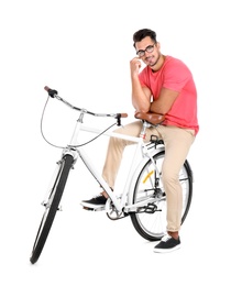 Photo of Handsome young hipster man with bicycle on white background