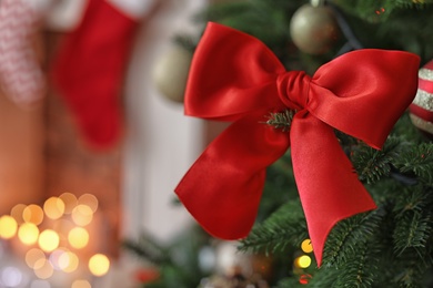 Photo of Christmas tree with stylish decor indoors, closeup