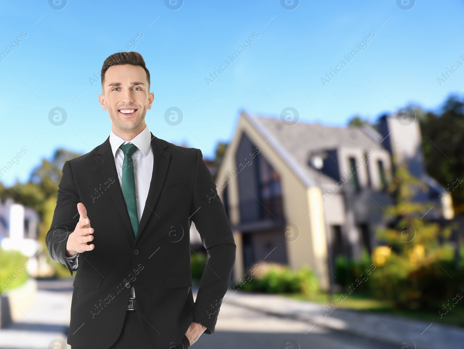 Image of Real estate agent against modern house. Space for text