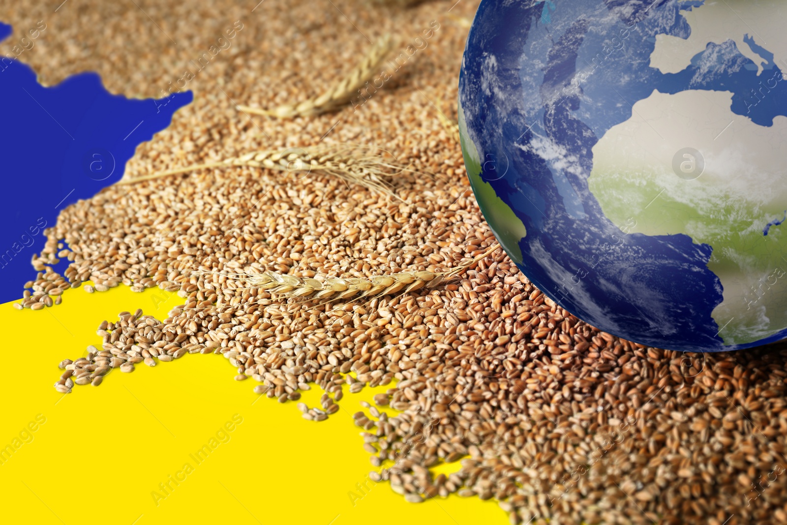 Image of Global food crisis concept. Wheat grains and globe of Earth on table in colors of Ukrainian flag