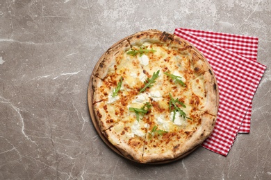 Image of Tasty cheese pizza on grey marble table, top view 