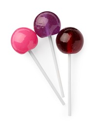 Photo of Many sweet colorful lollipops isolated on white, top view