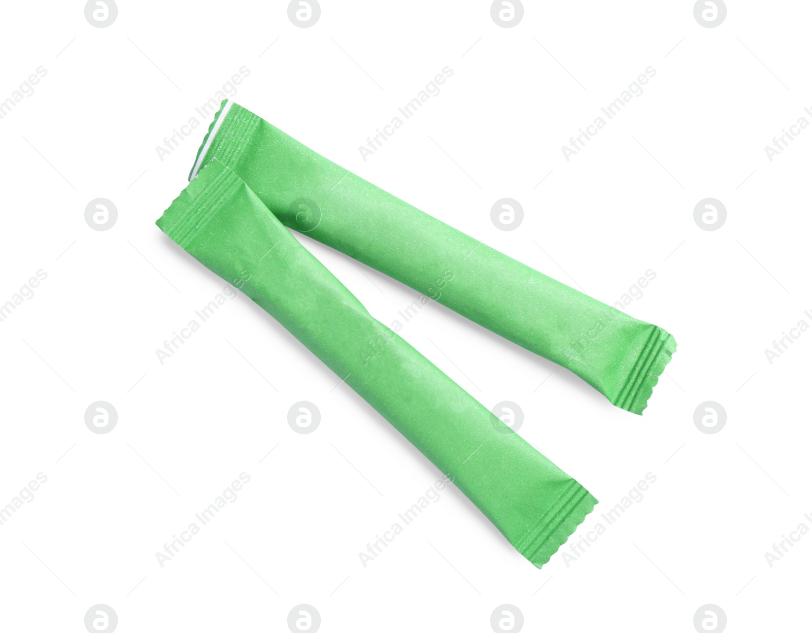 Photo of Green sticks of sugar on white background, top view