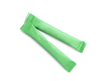 Green sticks of sugar on white background, top view