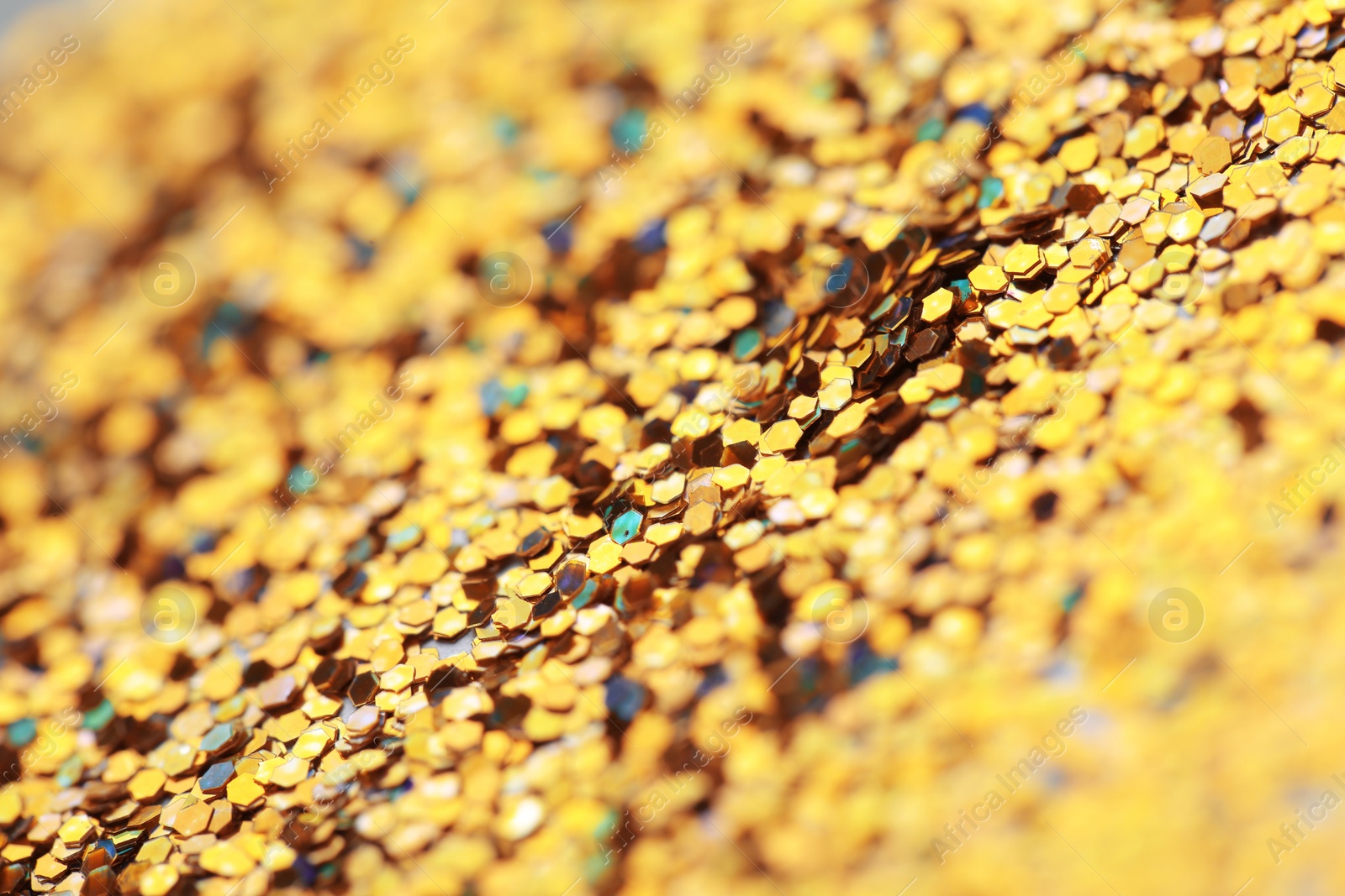 Photo of Many golden paillettes as background, closeup view