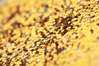 Many golden paillettes as background, closeup view