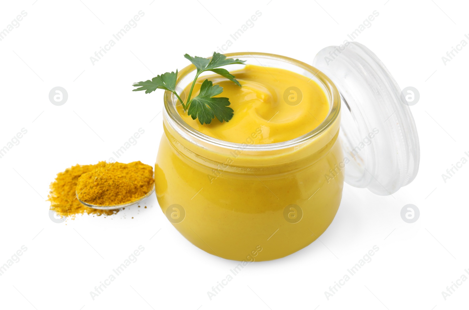 Photo of Jar with tasty curry sauce, powder and parsley isolated on white