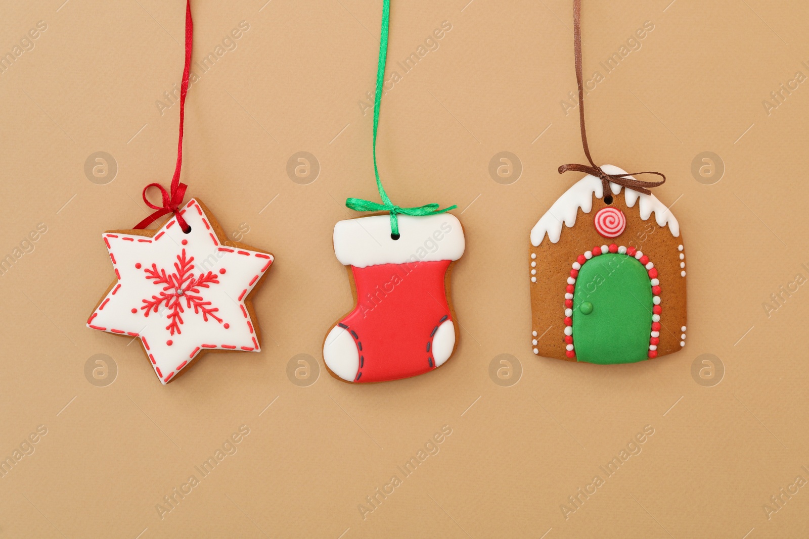 Photo of Different delicious Christmas cookies on brown background, flat lay