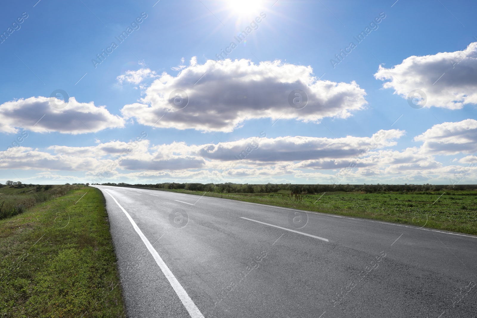 Image of View of empty asphalt road on sunny day