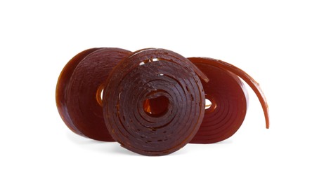 Photo of Delicious fruit leather rolls on white background