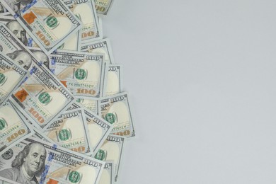 Photo of Money exchange. Dollar banknotes on gray background, top view. Space for text