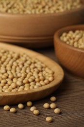 Photo of Natural organic soy beans on wooden table