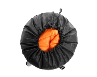 Photo of Rolled sleeping bag on white background, top view. Camping equipment