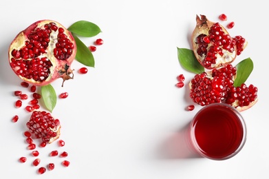 Photo of Glass of pomegranate juice and fresh fruits on white background, top view with space for text