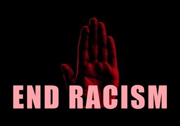 End Racism. Hand print on black background