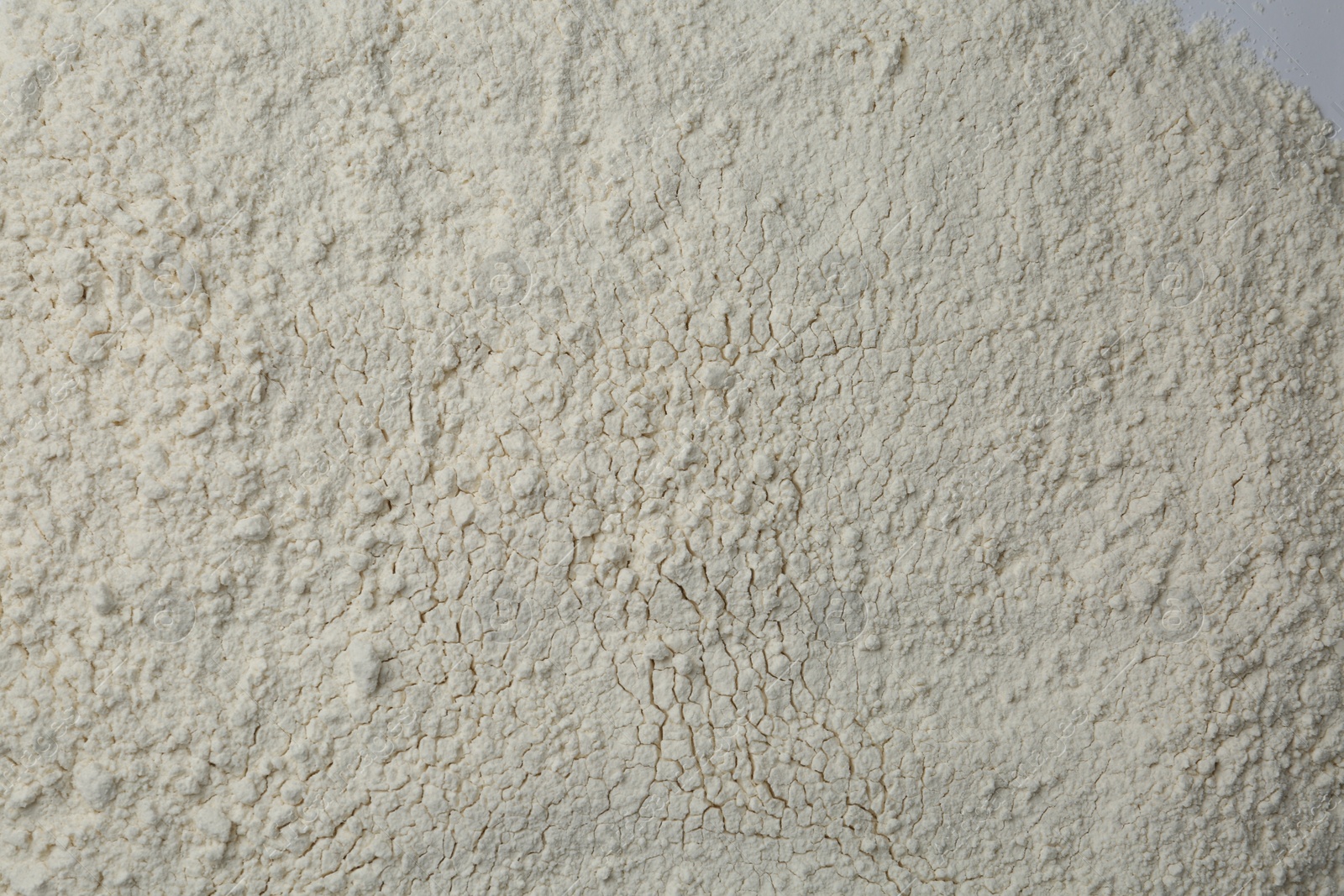 Photo of Pile of organic flour as background, top view