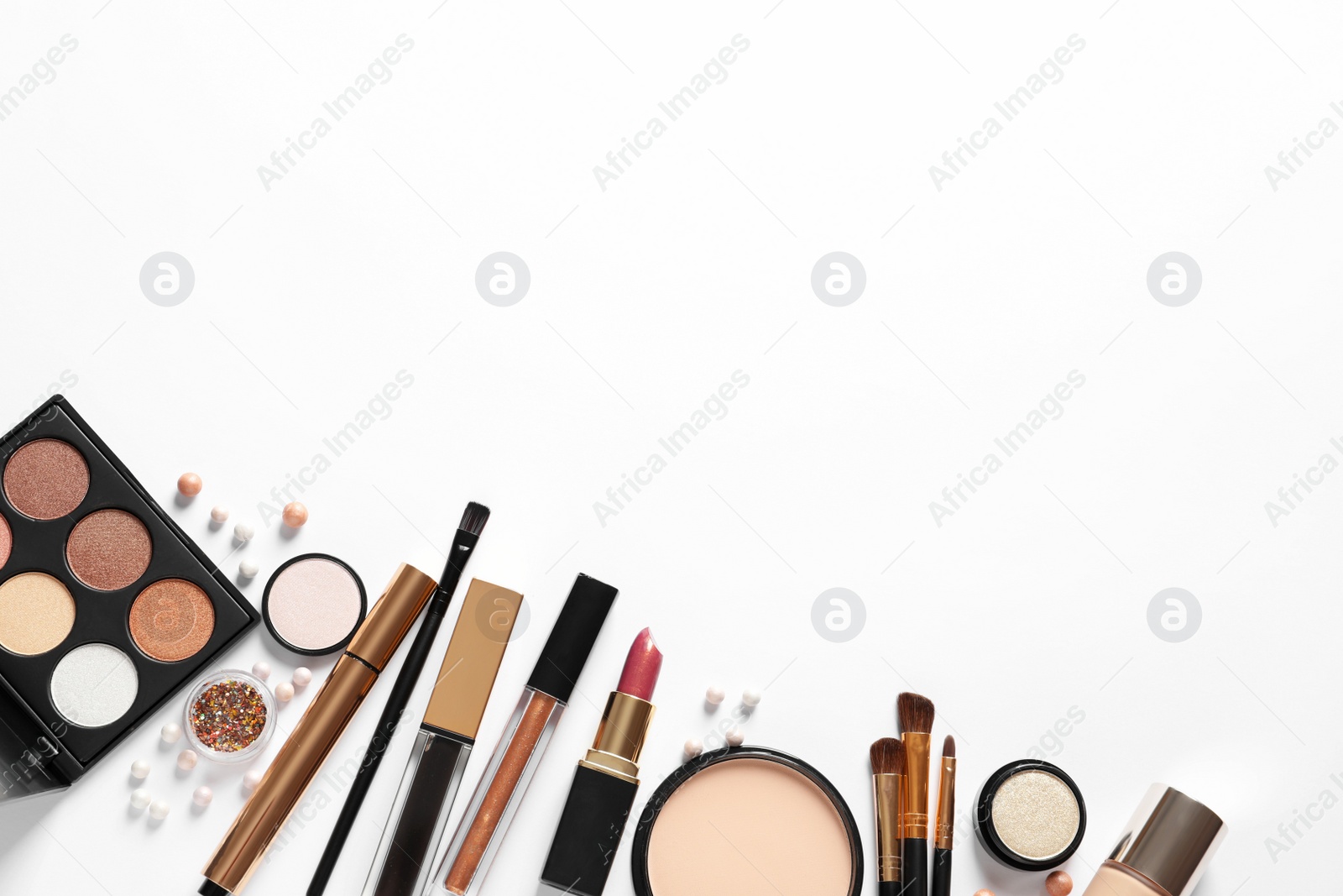 Photo of Different luxury makeup products on white background, top view