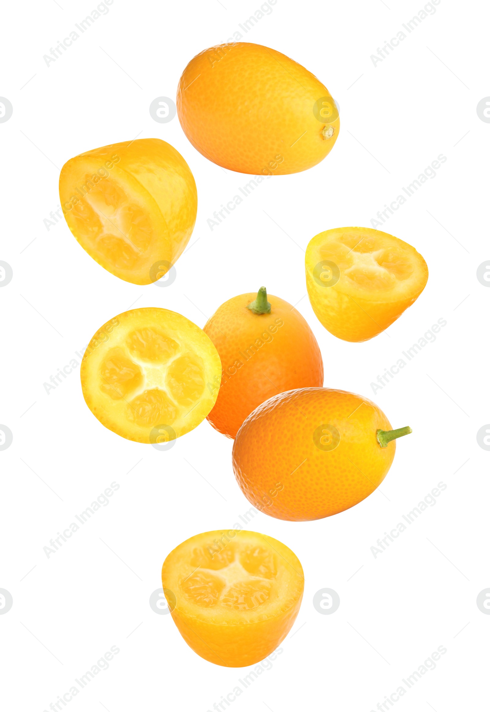 Image of Fresh ripe kumquat fruits falling on white background 