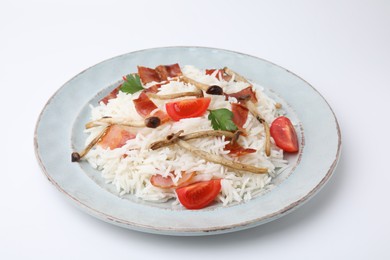 Photo of Delicious rice with bacon, mushrooms and tomatoes isolated on white