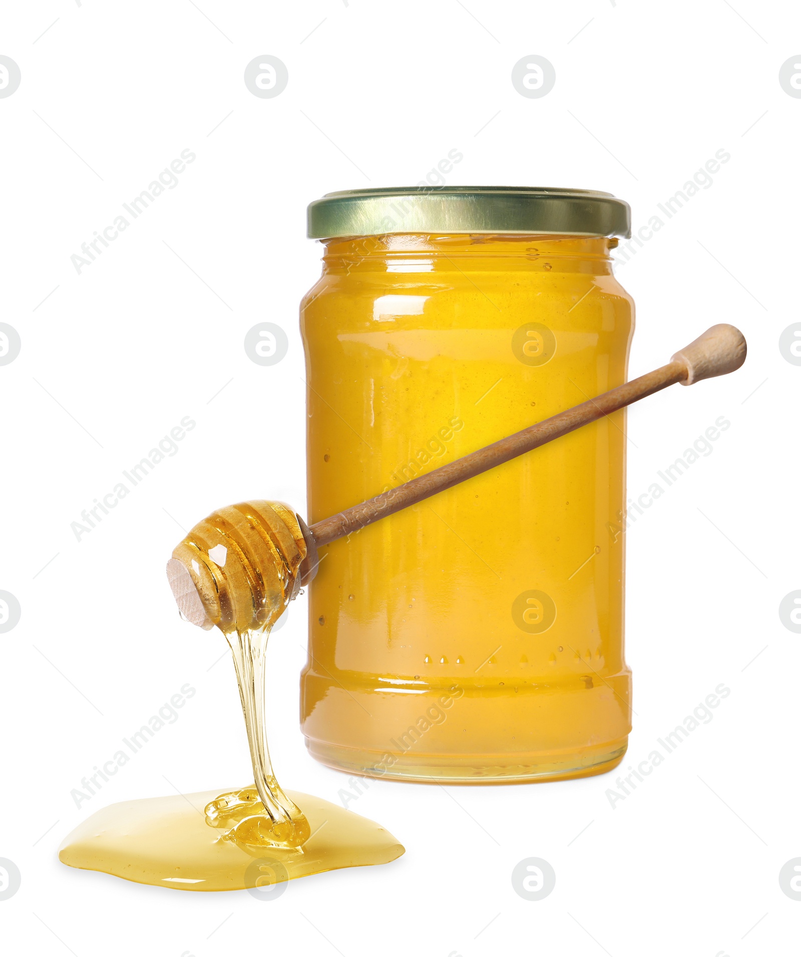 Image of Natural honey dripping from dipper. Jar full of honey on white background