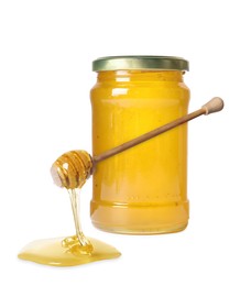 Natural honey dripping from dipper. Jar full of honey on white background