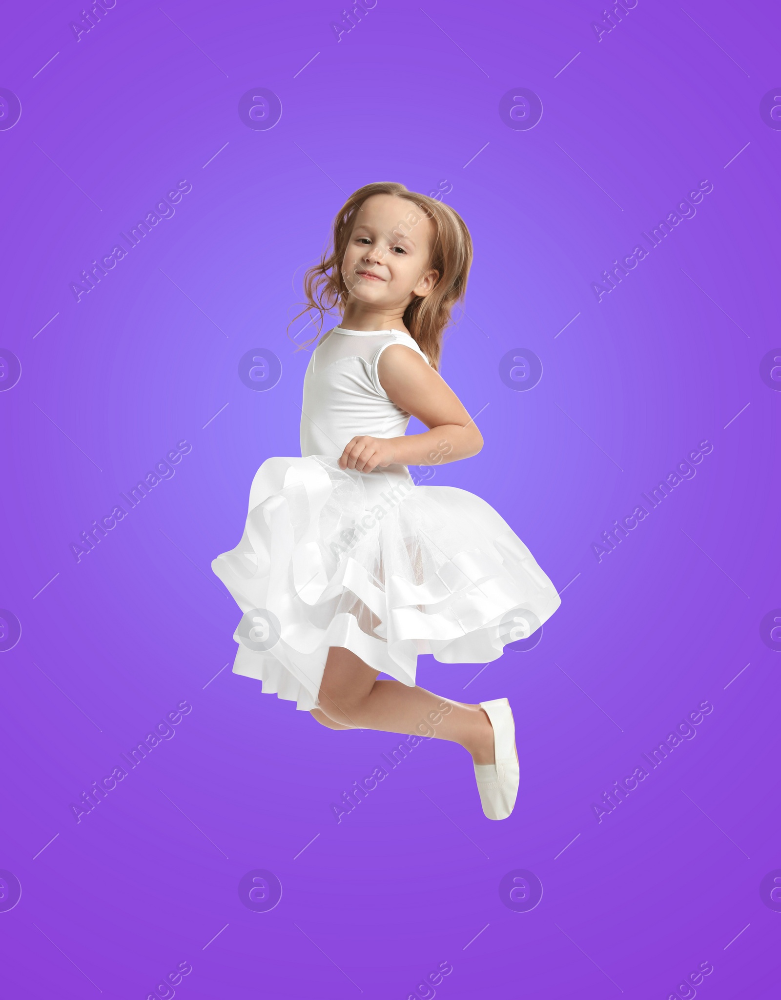 Image of Happy cute girl jumping on color gradient background