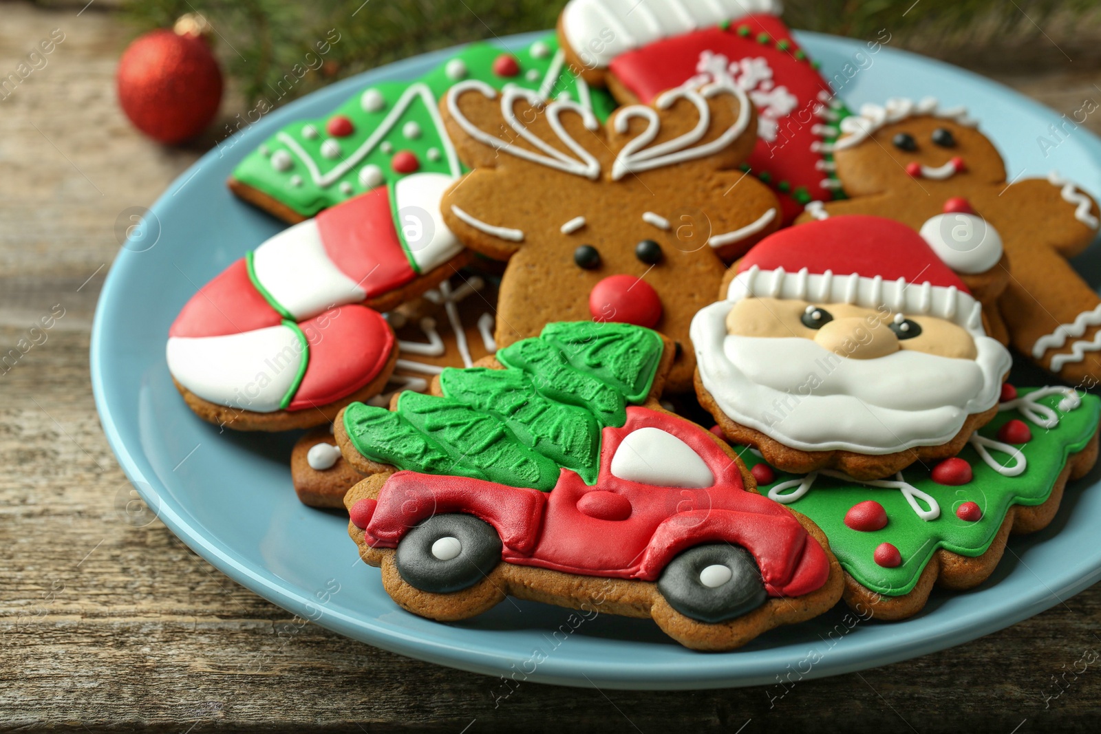Photo of Different tasty Christmas cookies on wooden table, closeup