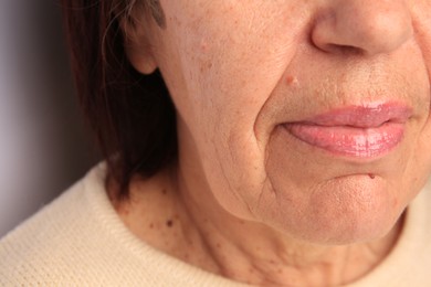 Photo of Skin care. Senior woman, closeup view of lips