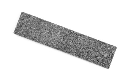 Photo of Sharpening stone for knife isolated on white, top view