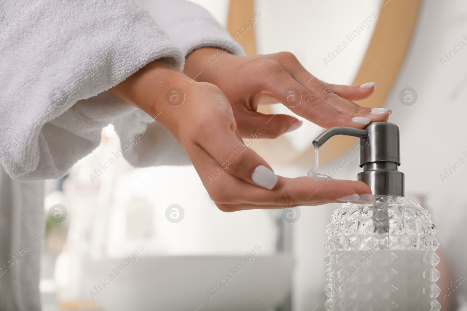 Photo of Teenage girl using gel in bathroom, closeup. Skin care cosmetic