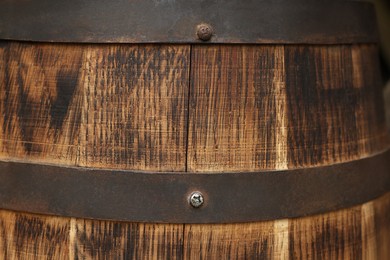 Photo of Traditional wooden barrel as background, closeup. Wine making