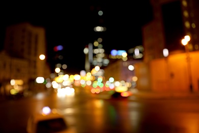 Photo of Blurred view of night cityscape with bokeh effect